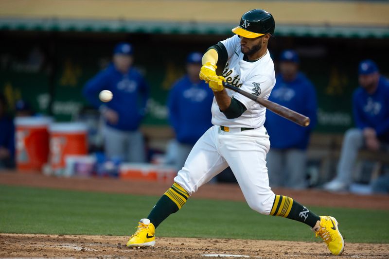 Jun 7, 2024; Oakland, California, USA; Oakland Athletics third baseman Abraham Toro (31) connects for a single against the Toronto Blue Jays during the sixth inning at Oakland-Alameda County Coliseum. Mandatory Credit: D. Ross Cameron-USA TODAY Sports