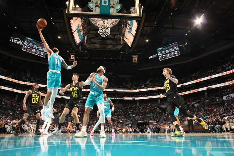 CHARLOTTE, NC - JANUARY 27: Cody Martin #11 of the Charlotte Hornets grabs the rebound during the game against the Utah Jazz on January 27, 2024 at Spectrum Center in Charlotte, North Carolina. NOTE TO USER: User expressly acknowledges and agrees that, by downloading and or using this photograph, User is consenting to the terms and conditions of the Getty Images License Agreement. Mandatory Copyright Notice: Copyright 2024 NBAE (Photo by Kent Smith/NBAE via Getty Images)