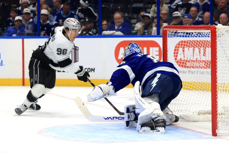 Dec 18, 2025; Tampa, Florida, USA; Los Angeles Kings left wing Andrei Kuzmenko (96) shoots as Tampa Bay Lightning goaltender Andrei Vasilevskiy (88) defends during the second period at Benchmark International Arena. Mandatory Credit: Kim Klement Neitzel-Imagn Images