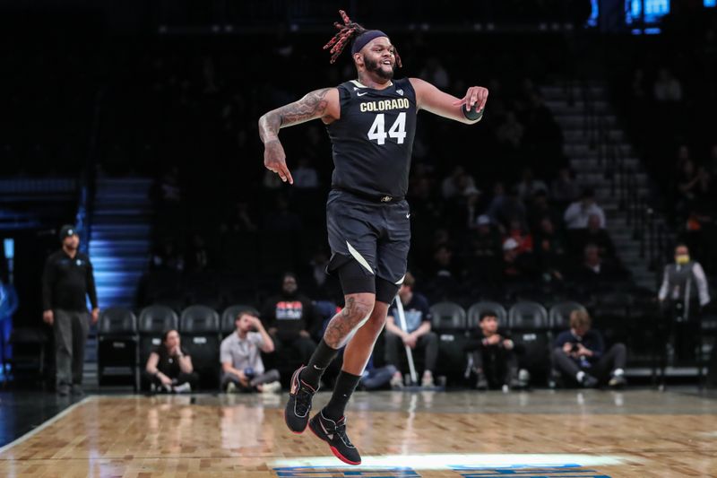 Dec 10, 2023; Brooklyn, New York, USA;  Colorado Buffaloes center Eddie Lampkin Jr. (44) celebrates after the Miami (Fl) Hurricanes call a timeout in the second half at Barclays Center. Mandatory Credit: Wendell Cruz-USA TODAY Sports