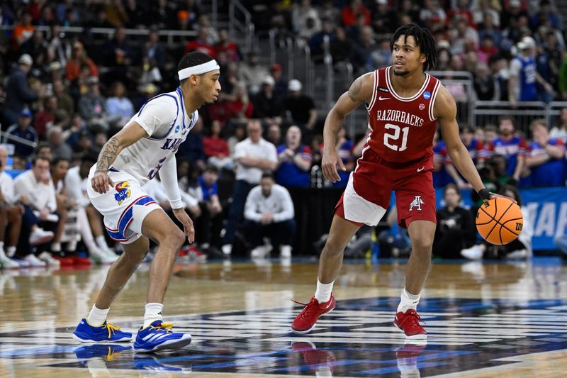 Mar 20, 2025; Providence, RI, USA;  Arkansas Razorbacks guard D.J. Wagner (21) controls the ball against ks- during the second half at Amica Mutual Pavilion. Mandatory Credit: Eric Canha-Imagn Images