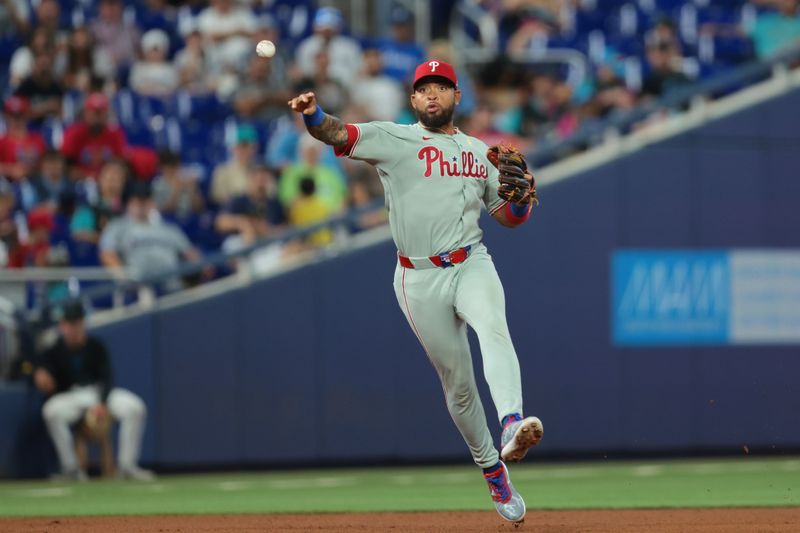 Sep 7, 2025; Miami, Florida, USA; Philadelphia Phillies shortstop Edmundo Sosa (33) throws to first base to retire Miami Marlins third baseman Maximo Acosta (not pictured) during the eighth inning at loanDepot Park. Mandatory Credit: Sam Navarro-Imagn Images