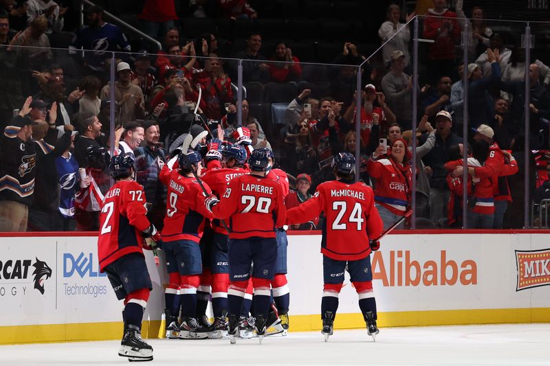 Oct 14, 2025; Washington, District of Columbia, USA; Washington Capitals players celebrate after their game against the Tampa Bay Lightning at Capital One Arena. Mandatory Credit: Geoff Burke-Imagn Images