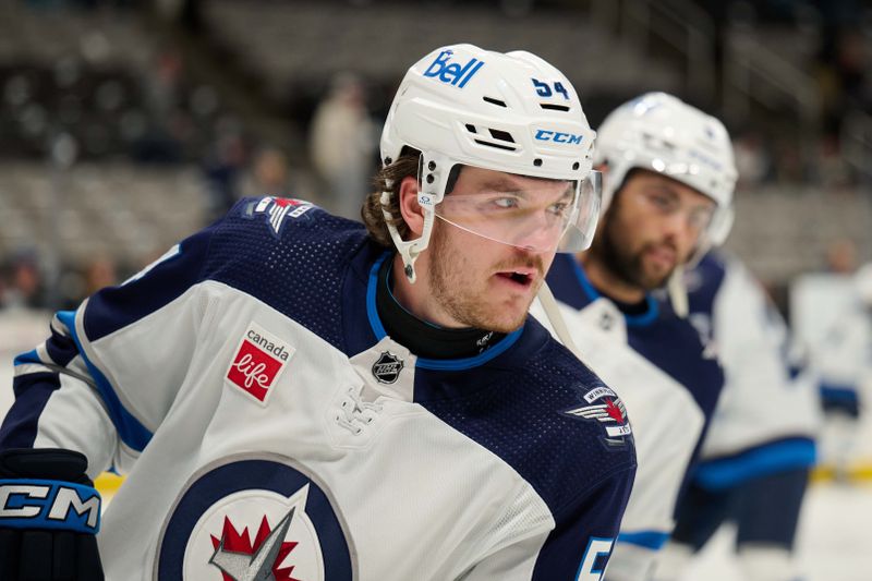 Dec 12, 2023; San Jose, California, USA; Winnipeg Jets defenseman Dylan Samberg (54) skates during warmups before the game between the San Jose Sharks and the Winnipeg Jets at SAP Center at San Jose. Mandatory Credit: Robert Edwards-USA TODAY Sports