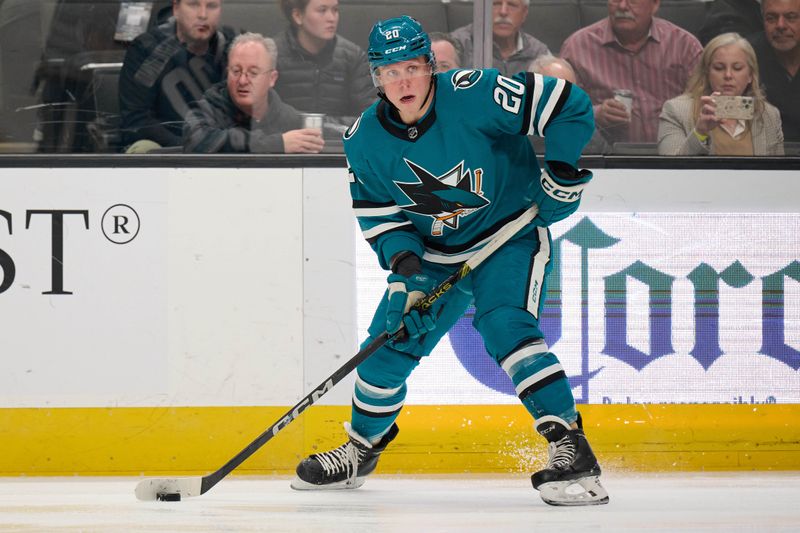 Dec 12, 2023; San Jose, California, USA; San Jose Sharks left wing Fabian Zetterlund (20) controls the puck against the Winnipeg Jets during the first period at SAP Center at San Jose. Mandatory Credit: Robert Edwards-USA TODAY Sports