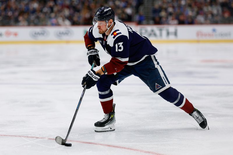 Mar 8, 2026; Denver, Colorado, USA; Colorado Avalanche right wing Valeri Nichushkin (13) controls the puck in the second period against the Minnesota Wild at Ball Arena. Mandatory Credit: Isaiah J. Downing-Imagn Images