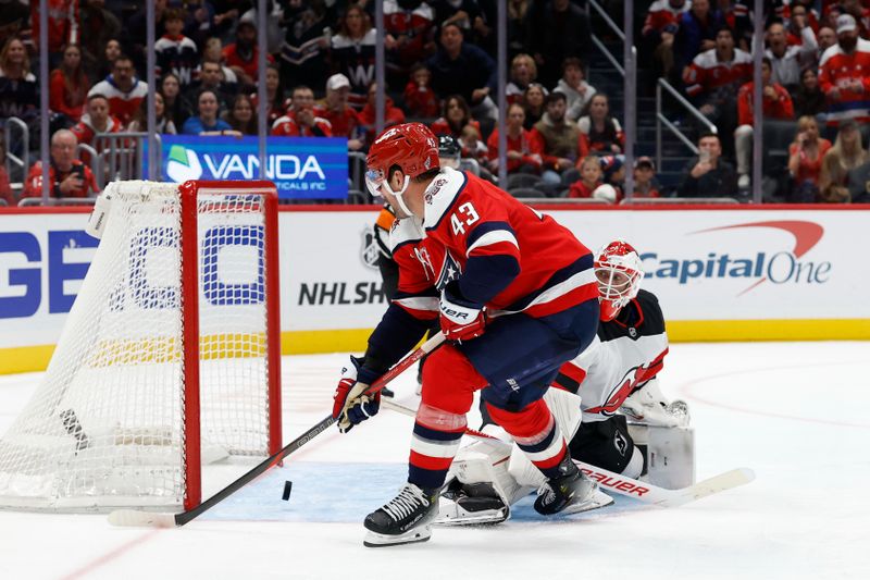 Nov 15, 2025; Washington, District of Columbia, USA; Washington Capitals right wing Tom Wilson (43) hits the post during a breakaway on New Jersey Devils goaltender Jake Allen (34) during the third period at Capital One Arena. Mandatory Credit: Geoff Burke-Imagn Images