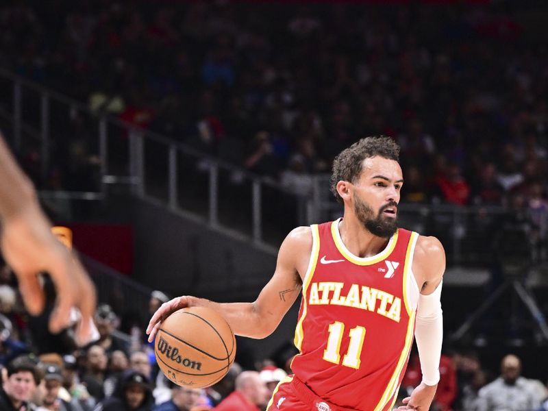 ATLANTA, GA - November 6:  Trae Young #11 of the Atlanta Hawks dribbles the ball during the game against the New York Knicks on November 6, 2024 at State Farm Arena in Atlanta, Georgia.  NOTE TO USER: User expressly acknowledges and agrees that, by downloading and/or using this Photograph, user is consenting to the terms and conditions of the Getty Images License Agreement. Mandatory Copyright Notice: Copyright 2024 NBAE (Photo by Adam Hagy/NBAE via Getty Images)