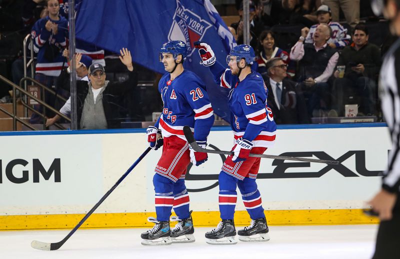 Sep 24, 2024; New York, New York, USA; New York Rangers right wing Reilly Smith (91) celebrates a goal by left wing Chris Kreider (20) during the third period against the New York Islanders at Madison Square Garden. Mandatory Credit: Danny Wild-Imagn Images