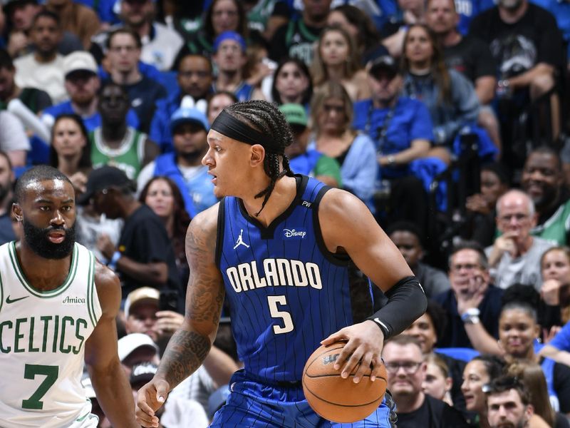 ORLANDO, FL - APRIL 25: Paolo Banchero #5 of the Orlando Magic dribbles the ball during Round One, Game Three of the 2025 NBA Playoffs against the Boston Celtics on April 25, 2025 at Kia Center in Orlando, Florida. NOTE TO USER: User expressly acknowledges and agrees that, by downloading and or using this photograph, User is consenting to the terms and conditions of the Getty Images License Agreement. Mandatory Copyright Notice: Copyright 2025 NBAE (Photo by Fernando Medina/NBAE via Getty Images)