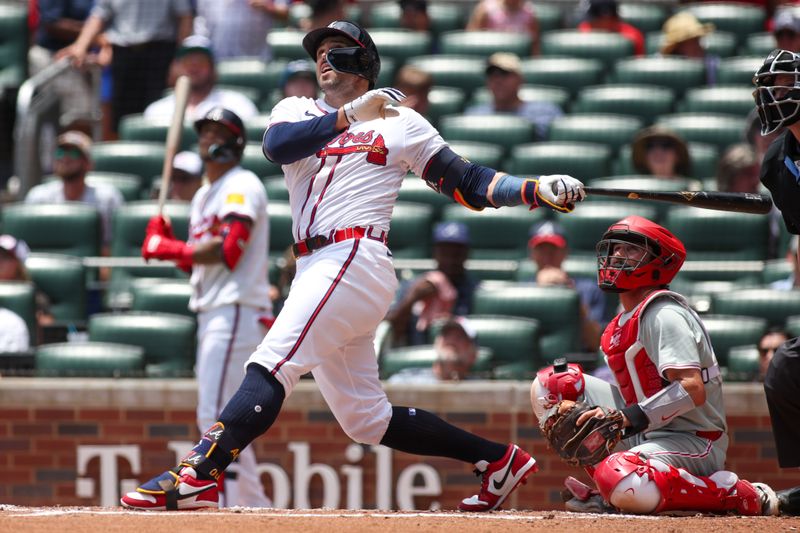 Jul 7, 2024; Atlanta, Georgia, USA; Atlanta Braves right fielder Adam Duvall (14) hits a home run against the Philadelphia Phillies in the second inning at Truist Park. Mandatory Credit: Brett Davis-USA TODAY Sports
