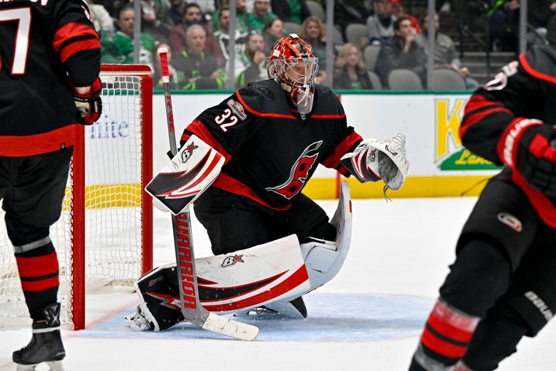 Jan 25, 2023; Dallas, Texas, USA; Carolina Hurricanes goaltender Antti Raanta (32) faces the Dallas Stars attack during the second period at the American Airlines Center. Mandatory Credit: Jerome Miron-USA TODAY Sports