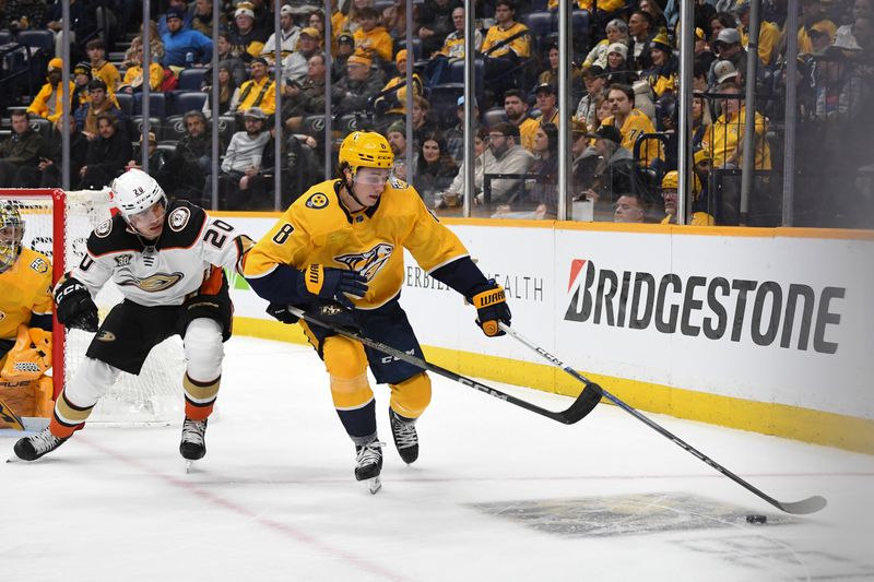 Jan 9, 2024; Nashville, Tennessee, USA; Nashville Predators center Cody Glass (8) handles the puck against Anaheim Ducks right wing Brett Leason (20) during the second period at Bridgestone Arena. Mandatory Credit: Christopher Hanewinckel-USA TODAY Sports