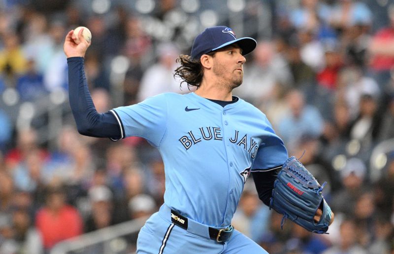 Aug 19, 2024; Toronto, Ontario, CAN; Toronto Blue Jays starting pitcher Kevin Gausman (34) delivers a pitch against the Cincinnati Reds in the first inning at Rogers Centre. Mandatory Credit: Dan Hamilton-USA TODAY Sports