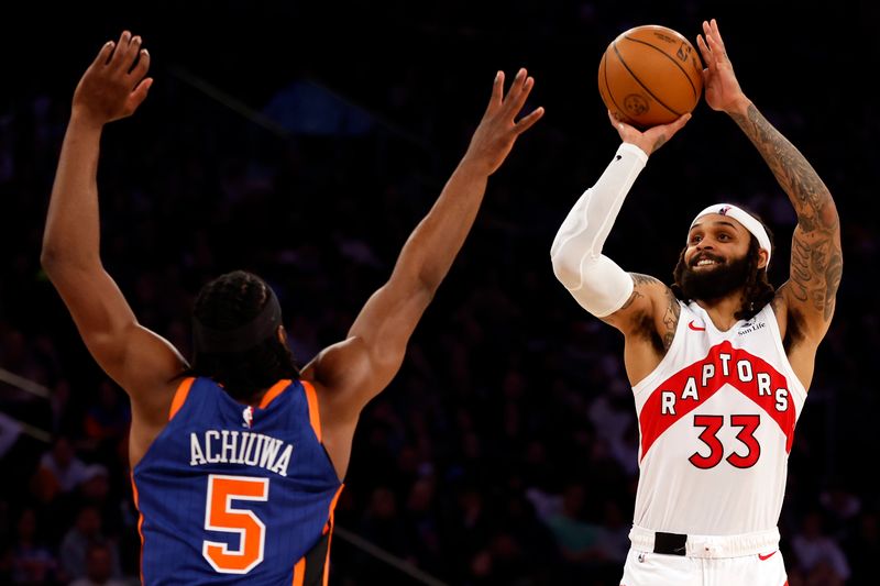 NEW YORK, NEW YORK - JANUARY 20: Gary Trent Jr. #33 of the Toronto Raptors shoots the ball as Precious Achiuwa #5 of the New York Knicks defends during the second half at Madison Square Garden on January 20, 2024 in New York City. The Knicks won 126-120. NOTE TO USER: User expressly acknowledges and agrees that, by downloading and/or using this Photograph, user is consenting to the terms and conditions of the Getty Images License Agreement. (Photo by Sarah Stier/Getty Images)