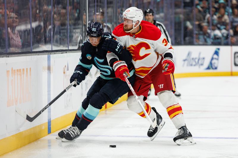 Oct 19, 2024; Seattle, Washington, USA; Calgary Flames right wing Anthony Mantha (39) collides into Seattle Kraken left wing Andre Burakovsky (95) during the third period at Climate Pledge Arena. Mandatory Credit: Caean Couto-Imagn Images