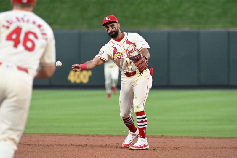 Sep 7, 2024; St. Louis, Missouri, USA; St. Louis Cardinals second baseman Jose Fermin (15) throws to first base for an out against the Seattle Mariners in the third inning at Busch Stadium. Mandatory Credit: Joe Puetz-Imagn Images