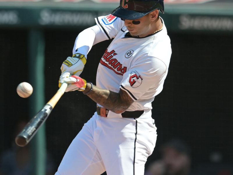Sep 15, 2024; Cleveland, Ohio, USA; Cleveland Guardians shortstop Brayan Rocchio (4) hits an RBI single during the second inning against the Tampa Bay Rays at Progressive Field. Mandatory Credit: Ken Blaze-Imagn Images