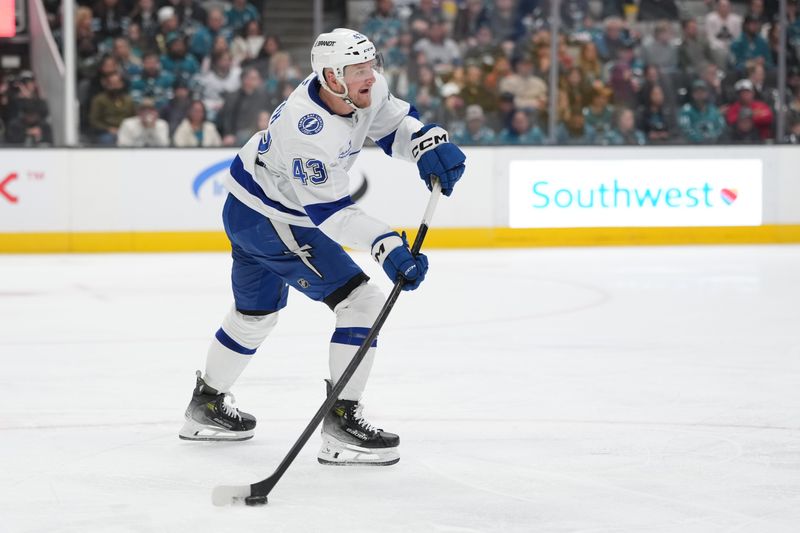 Jan 3, 2026; San Jose, California, USA; Tampa Bay Lightning defenseman Darren Raddysh (43) passes against the San Jose Sharks during the second period at SAP Center at San Jose. Mandatory Credit: Darren Yamashita-Imagn Images