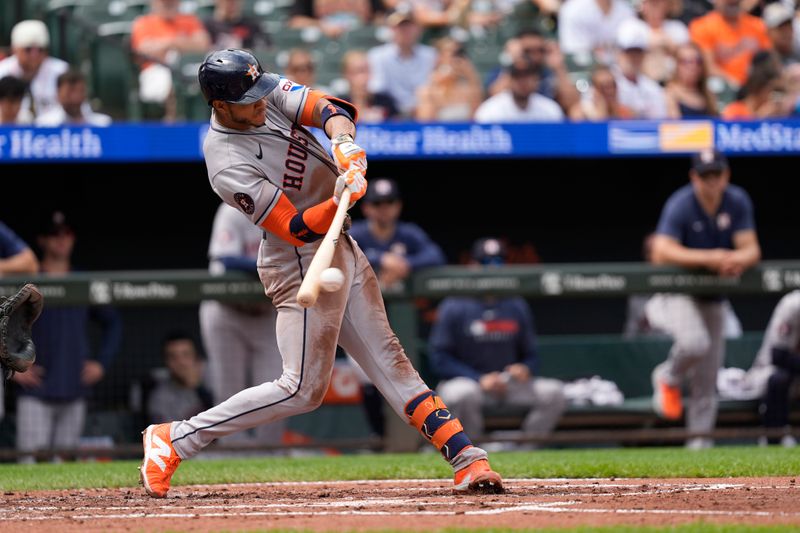 Aug 24, 2025; Baltimore, Maryland, USA; Houston Astros shortstop Jeremy Pena (3) hits an RBI single against the Baltimore Orioles during the third inning at Oriole Park at Camden Yards. Mandatory Credit: Gregory Fisher-Imagn Images