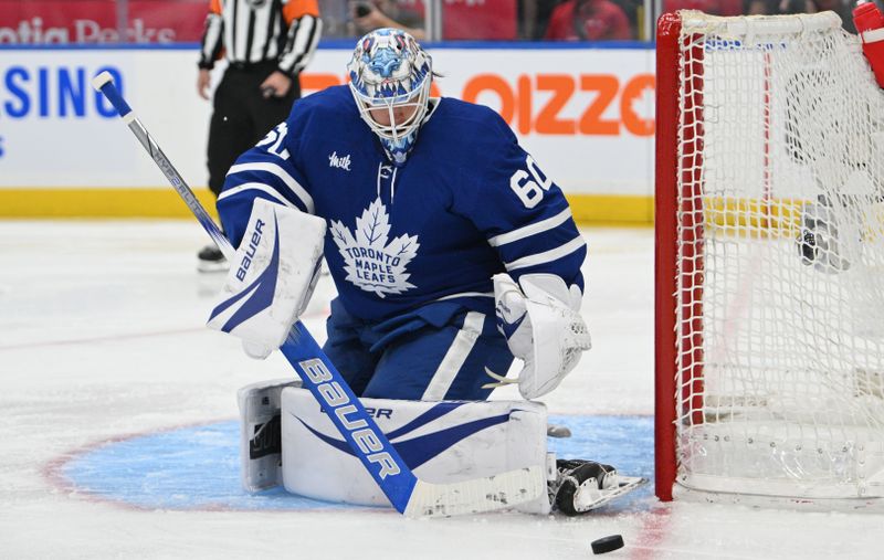 Oct 31, 2024; Toronto, Ontario, CAN;  Toronto Maple Leafs goalie Joseph Woll (60) makes a save against the Seattle Kraken in the second period at Scotiabank Arena. Mandatory Credit: Dan Hamilton-Imagn Images