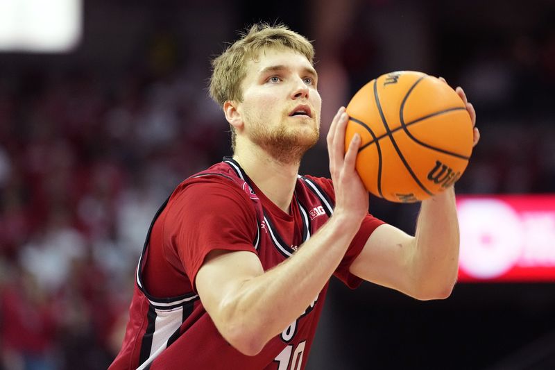 Feb 18, 2023; Madison, Wisconsin, USA;  Rutgers Scarlet Knights guard Cam Spencer (10) shoots a free throw during the first half against the Wisconsin Badgers at the Kohl Center. Mandatory Credit: Kayla Wolf-USA TODAY Sports