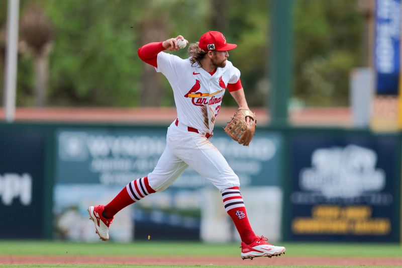Mar 15, 2025; Jupiter, Florida, USA; St. Louis Cardinals second baseman Brendan Donovan (33) throws to first base to retire Toronto Blue Jays shortstop Leo Jimenez (not pictured) during the fourth inning at Roger Dean Chevrolet Stadium. Mandatory Credit: Sam Navarro-Imagn Images