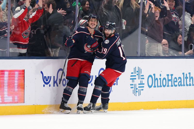 Jan 24, 2026; Columbus, Ohio, USA;  Columbus Blue Jackets left wing Mason Marchment (17) celebrates his third goal of the game with center Adam Fantilli (19) during the third period against the Tampa Bay Lightning at Nationwide Arena. Mandatory Credit: Joseph Maiorana-Imagn Images