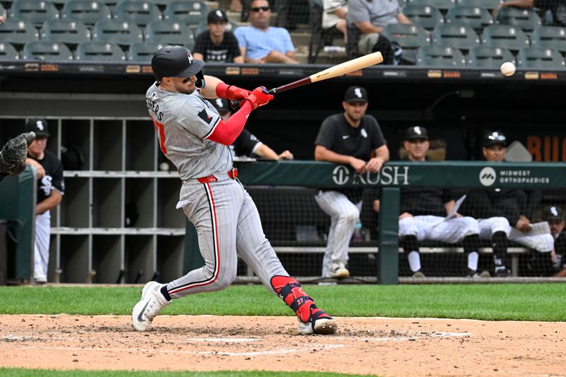 Jul 10, 2024; Chicago, Illinois, USA;  Minnesota Twins catcher Ryan Jeffers (27) hits a RBI single against the Chicago White Sox during the seventh inning at Guaranteed Rate Field. Mandatory Credit: Matt Marton-USA TODAY Sports