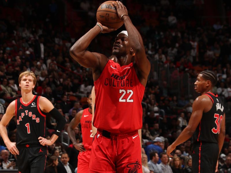 MIAMI, FL - DECEMBER 12:  Jimmy Butler #22 of the Miami Heat shoots a free throw during the game against the Toronto Raptors on December 12, 2024 at Kaseya Center in Miami, Florida. NOTE TO USER: User expressly acknowledges and agrees that, by downloading and or using this Photograph, user is consenting to the terms and conditions of the Getty Images License Agreement. Mandatory Copyright Notice: Copyright 2024 NBAE (Photo by Issac Baldizon/NBAE via Getty Images)