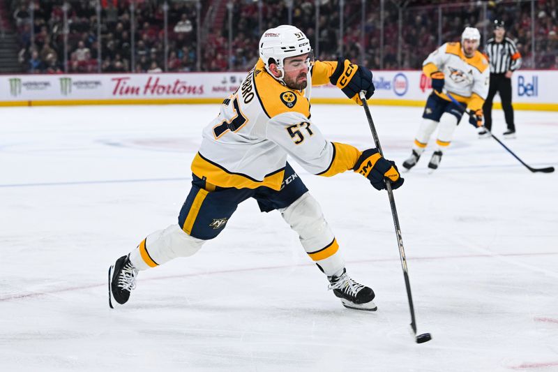 Dec 10, 2023; Montreal, Quebec, CAN; Nashville Predators defenseman Dante Fabbro (57) shoots the puck against the Montreal Canadiens during the second period at Bell Centre. Mandatory Credit: David Kirouac-USA TODAY Sports