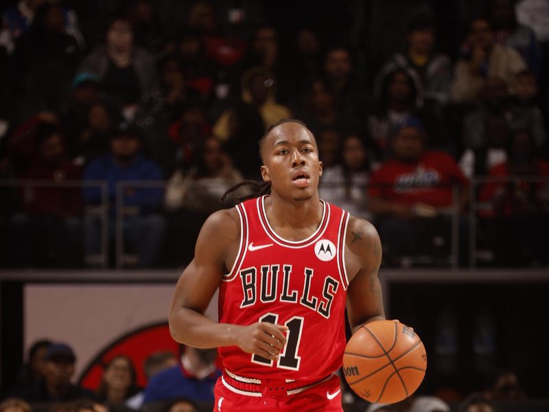 DETROIT, MI - NOVEMBER 18: Ayo Dosunmu #11 of the Chicago Bulls dribbles the ball during the game against the Detroit Pistons on November 18, 2024 at Little Caesars Arena in Detroit, Michigan. NOTE TO USER: User expressly acknowledges and agrees that, by downloading and/or using this photograph, User is consenting to the terms and conditions of the Getty Images License Agreement. Mandatory Copyright Notice: Copyright 2024 NBAE (Photo by Brian Sevald/NBAE via Getty Images)