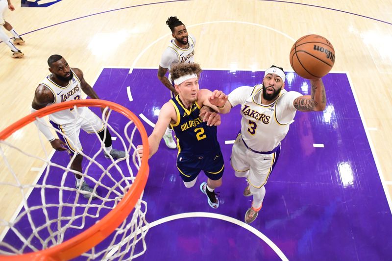 LOS ANGELES, CA - MACH 16: Anthony Davis #3 of the Los Angeles Lakers rebounds the ball during the game against the Golden State Warriors on March 16, 2024 at Crypto.Com Arena in Los Angeles, California. NOTE TO USER: User expressly acknowledges and agrees that, by downloading and/or using this Photograph, user is consenting to the terms and conditions of the Getty Images License Agreement. Mandatory Copyright Notice: Copyright 2024 NBAE (Photo by Adam Pantozzi/NBAE via Getty Images)