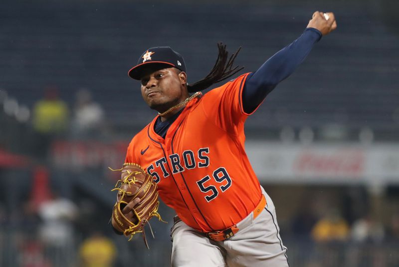 Jun 5, 2025; Pittsburgh, Pennsylvania, USA;  Houston Astros starting pitcher Framber Valdez (59) delivers a pitch against the Pittsburgh Pirates during the first inning at PNC Park. Mandatory Credit: Charles LeClaire-Imagn Images