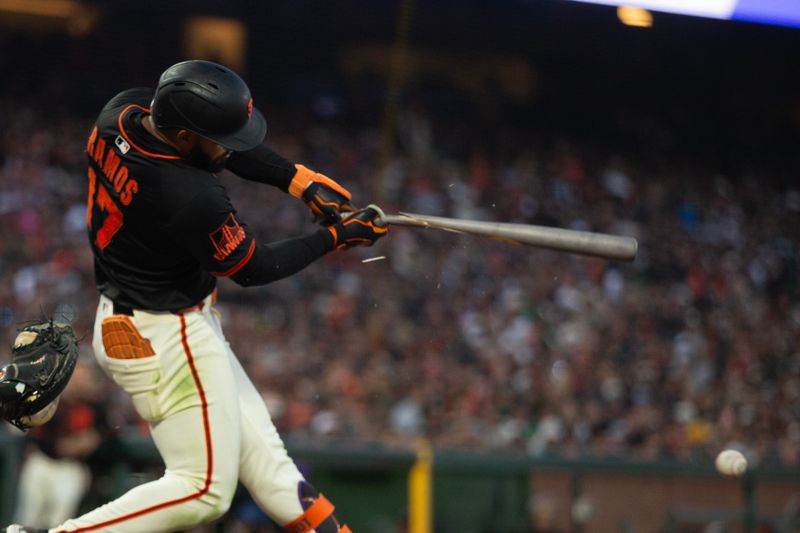 May 17, 2025; San Francisco, California, USA; San Francisco Giants left fielder Heliot Ramos (17) breaks his bat grounding out against the Athletics during the ninth inning at Oracle Park. Mandatory Credit: D. Ross Cameron-Imagn Images