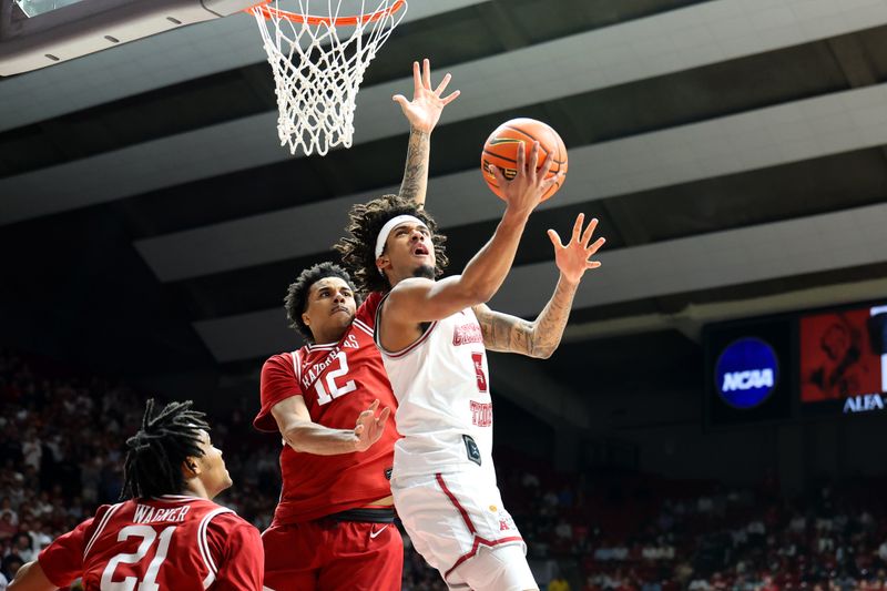 Feb 18, 2026; Tuscaloosa, Alabama, USA; Alabama Crimson Tide forward Amari Allen (5) shoots the ball against Arkansas Razorback forward Malique Ewin (12) during the second half at Coleman Coliseum. Mandatory Credit: David Leong-Imagn Images