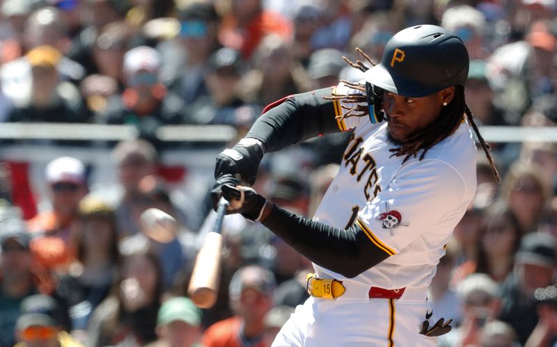 Apr 7, 2024; Pittsburgh, Pennsylvania, USA;  Pittsburgh Pirates shortstop Oneil Cruz (15) hits a double against the Baltimore Orioles during the third inning at PNC Park. Mandatory Credit: Charles LeClaire-USA TODAY Sports