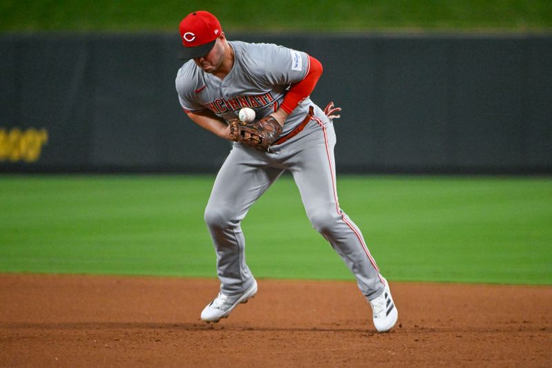 Sep 11, 2024; St. Louis, Missouri, USA;  Cincinnati Reds first baseman Ty France (2) fields a ground ball against the St. Louis Cardinals during the fifth inning at Busch Stadium. Mandatory Credit: Jeff Curry-Imagn Images