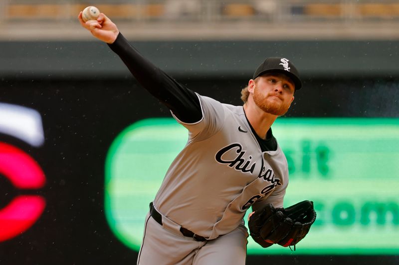 Apr 24, 2025; Minneapolis, Minnesota, USA; Chicago White Sox starting pitcher Shane Smith (64) throws to the Minnesota Twins in the first inning at Target Field. Mandatory Credit: Bruce Kluckhohn-Imagn Images