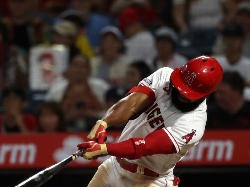 Sep 6, 2023; Anaheim, California, USA;  Los Angeles Angels shortstop Luis Rengifo (2) hits a 2-run home run during the third inning against the Baltimore Orioles at Angel Stadium. Mandatory Credit: Kiyoshi Mio-USA TODAY Sports