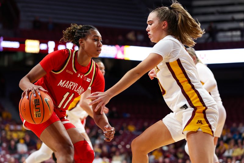 Jan 3, 2024; Minneapolis, Minnesota, USA; Maryland Terrapins guard Jakia Brown-Turner (11) controls he ball as Minnesota Golden Gophers guard Mara Braun (10) defends during the second half at Williams Arena. Mandatory Credit: Matt Krohn-USA TODAY Sports