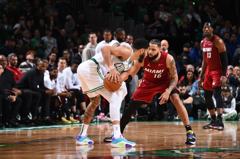 BOSTON, MA - APRIL 21: Caleb Martin #16 of the Miami Heat plays defense against the Boston Celtics during Round 1 Game 1 of the 2024 NBA Playoffs on April 21, 2024 at the TD Garden in Boston, Massachusetts. NOTE TO USER: User expressly acknowledges and agrees that, by downloading and or using this photograph, User is consenting to the terms and conditions of the Getty Images License Agreement. Mandatory Copyright Notice: Copyright 2024 NBAE  (Photo by Brian Babineau/NBAE via Getty Images)