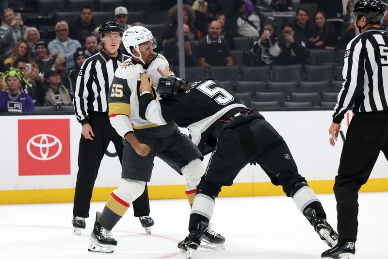 Oct 30, 2024; Los Angeles, California, USA;  Vegas Golden Knights right wing Keegan Kolesar (55) and Los Angeles Kings defenseman Andreas Englund (5) fight on the ice during the first period at Crypto.com Arena. Mandatory Credit: Kiyoshi Mio-Imagn Images