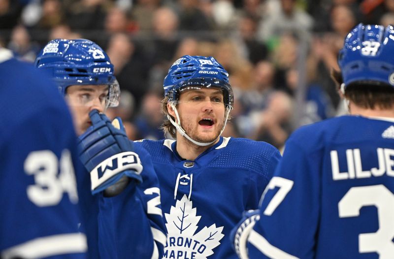 Jan 14, 2024; Toronto, Ontario, CAN;  Toronto Maple Leafs forward William Nylander (88) speaks with teammates during a break in play against the Detroit Red Wings in the second period at Scotiabank Arena. Mandatory Credit: Dan Hamilton-USA TODAY Sports