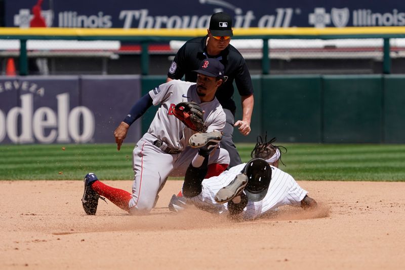 Jun 9, 2024; Chicago, Illinois, USA; Chicago White Sox outfielder Corey Julks (30) steals second base as Boston Red Sox shortstop David Hamilton (70) takes a late throw during the third inning at Guaranteed Rate Field. Mandatory Credit: David Banks-USA TODAY Sports