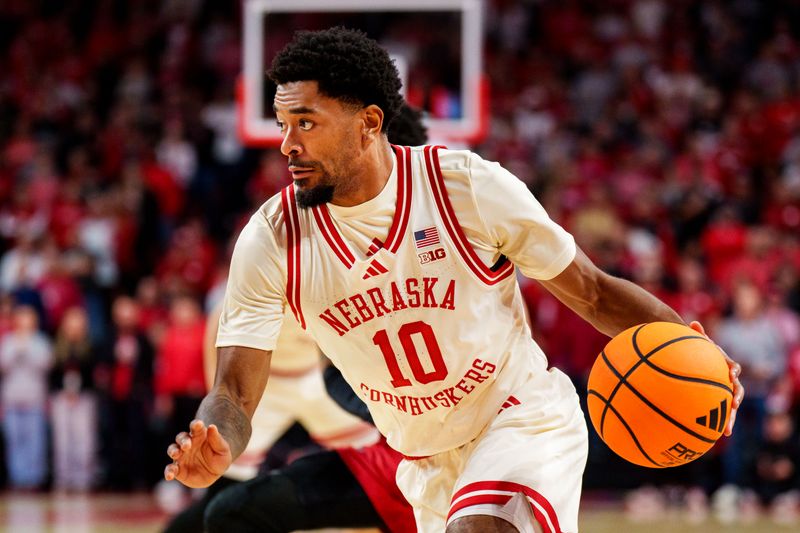 Dec 10, 2025; Lincoln, Nebraska, USA; Nebraska Cornhuskers guard Jamarques Lawrence (10) drives against the Wisconsin Badgers during the first half at Pinnacle Bank Arena. Mandatory Credit: Dylan Widger-Imagn Images