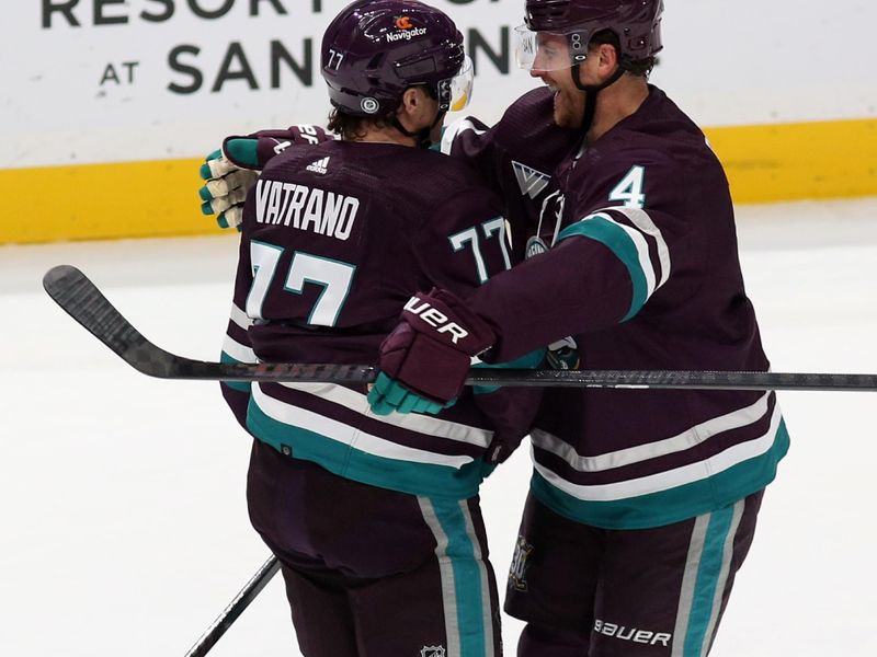 Nov 12, 2023; Anaheim, California, USA; Anaheim Ducks right wing Frank Vatrano (77) celebrates with defenseman Cam Fowler (4) after scoring during the first period against the San Jose Sharks at Honda Center. Mandatory Credit: Jason Parkhurst-USA TODAY Sports