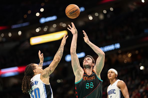 WASHINGTON, DC - DECEMBER 26: Danilo Gallinari #88 of the Washington Wizards shoots the ball against Cole Anthony #50 of the Orlando Magic during the second half at Capital One Arena on December 26, 2023 in Washington, DC. NOTE TO USER: User expressly acknowledges and agrees that, by downloading and or using this photograph, User is consenting to the terms and conditions of the Getty Images License Agreement. (Photo by Scott Taetsch/Getty Images)