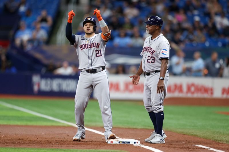 Aug 13, 2024; St. Petersburg, Florida, USA; Houston Astros first baseman Yainer Diaz (21) celebrates after hitting an rbi single against the Tampa Bay Rays in the third inning at Tropicana Field. Mandatory Credit: Nathan Ray Seebeck-USA TODAY Sports