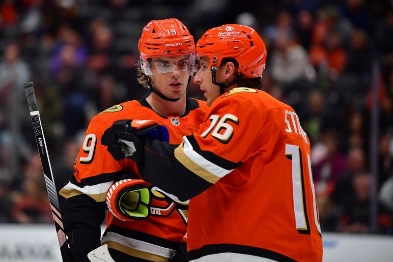 Oct 16, 2024; Anaheim, California, USA; Anaheim Ducks right wing Troy Terry (19) speaks with center Ryan Strome (16) during the second period at Honda Center. Mandatory Credit: Gary A. Vasquez-Imagn Images